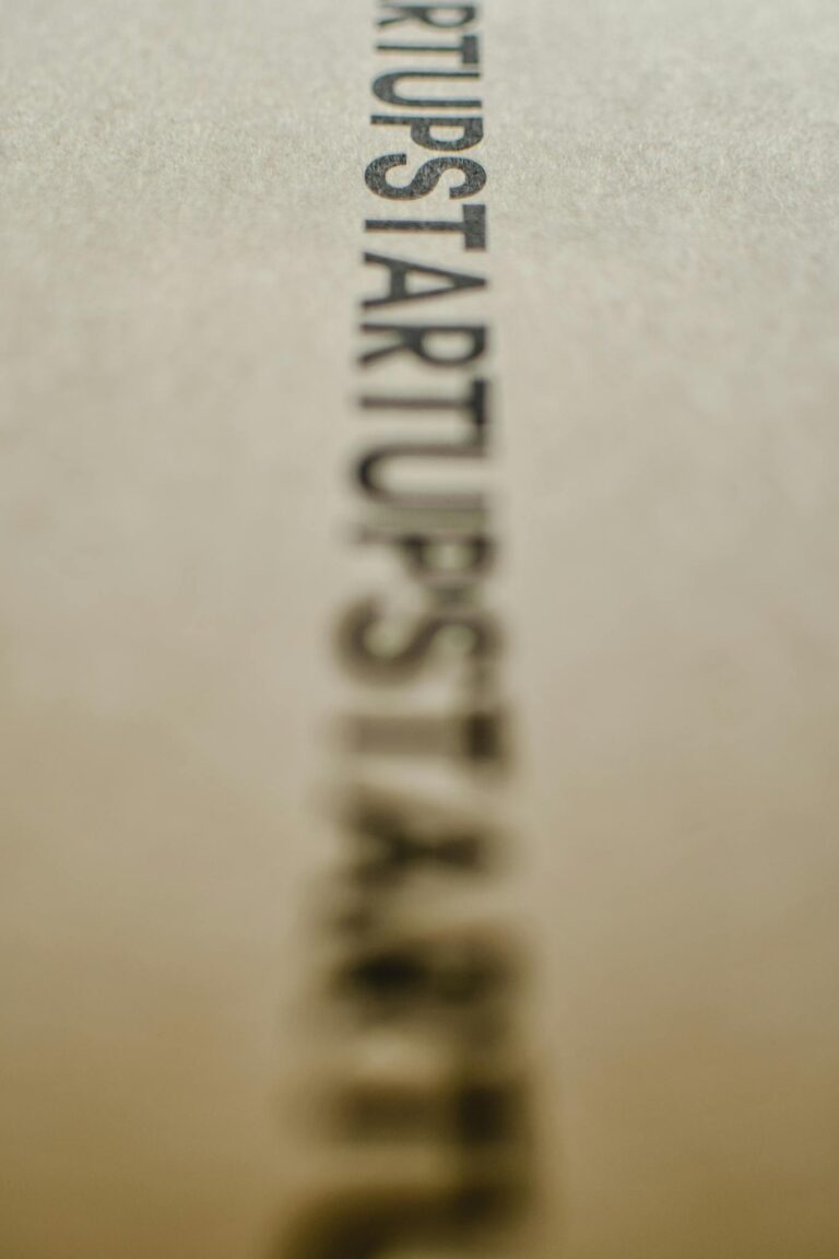 Blurred focus on the word 'Startup' on a textured paper surface.