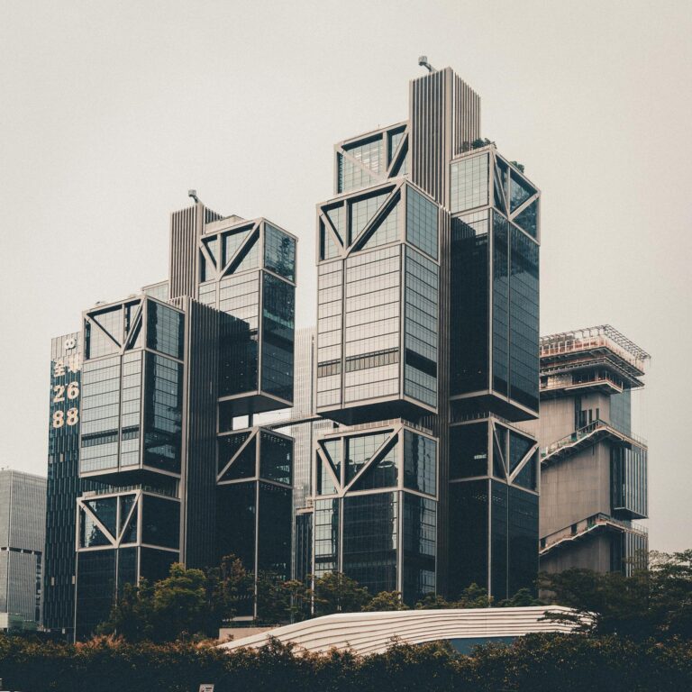 Impressive modern architecture of tall skyscrapers in an urban cityscape, highlighting geometric design.